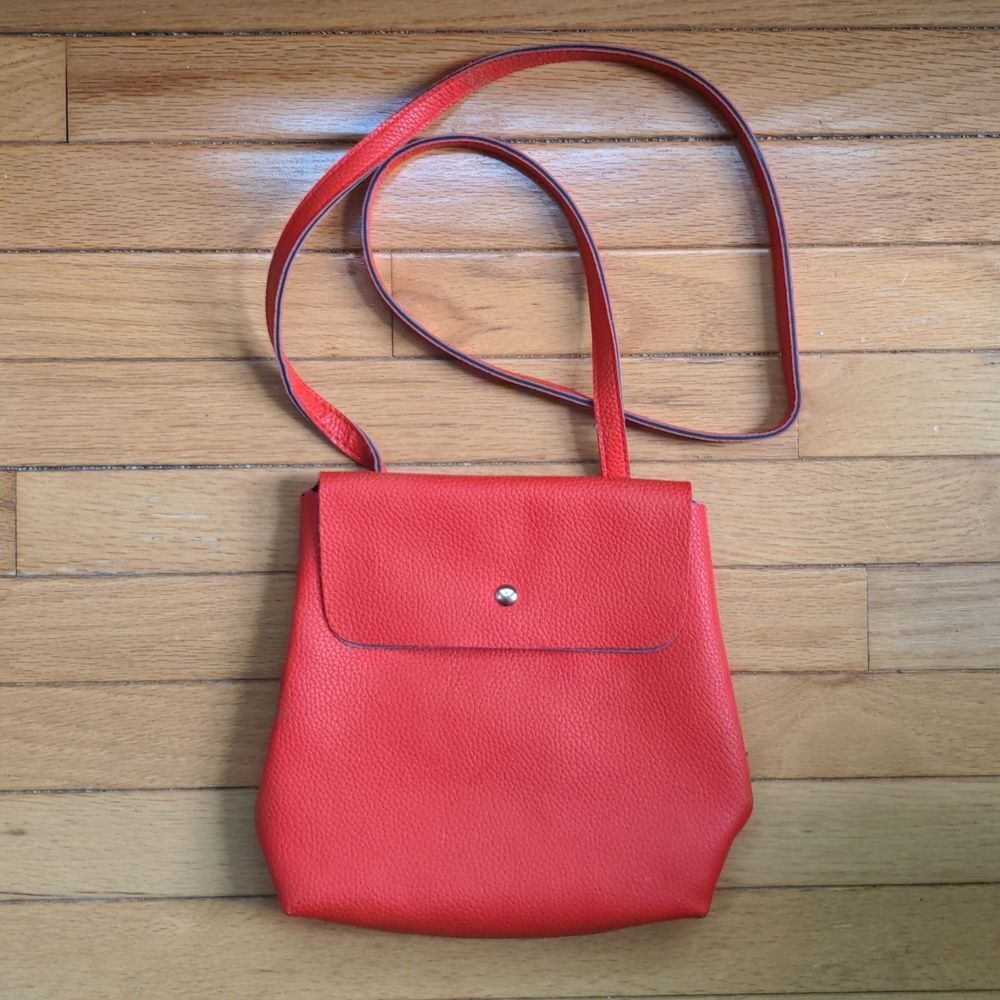 Red convertible crossbody / backpack bag